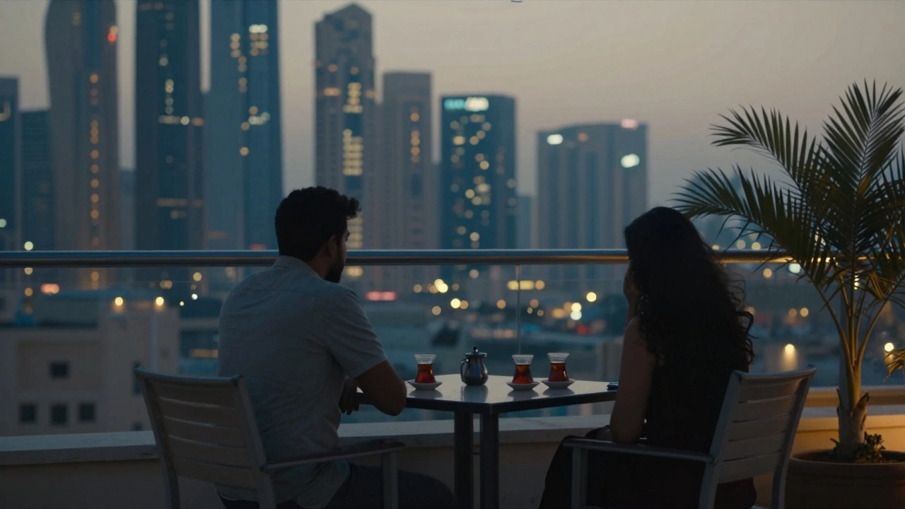 Two figures sit in silence on a Dubai rooftop terrace at dusk, city lights glowing softly behind them.